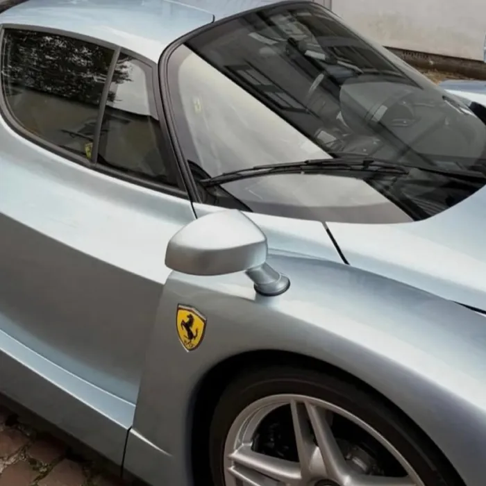 Door and wheel of a silver sports car